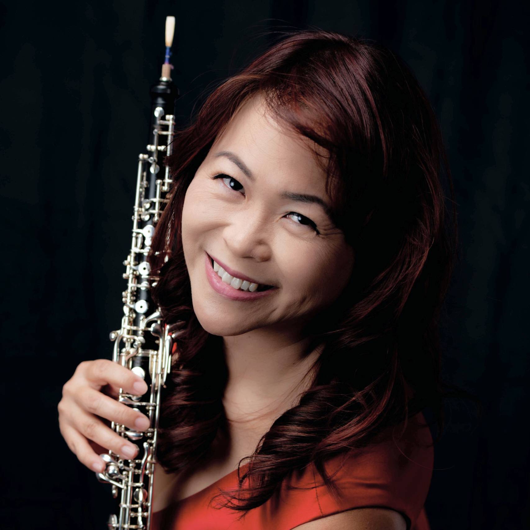 a person holding a clarinet