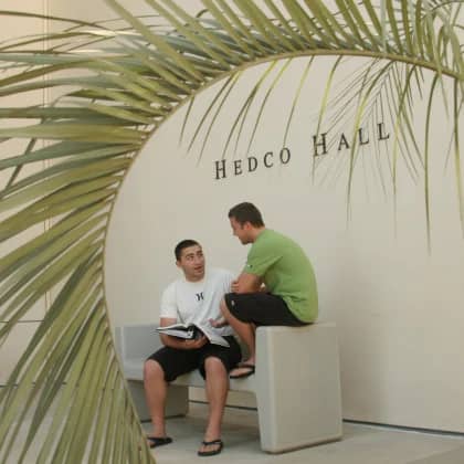 a couple of men sitting on a bench