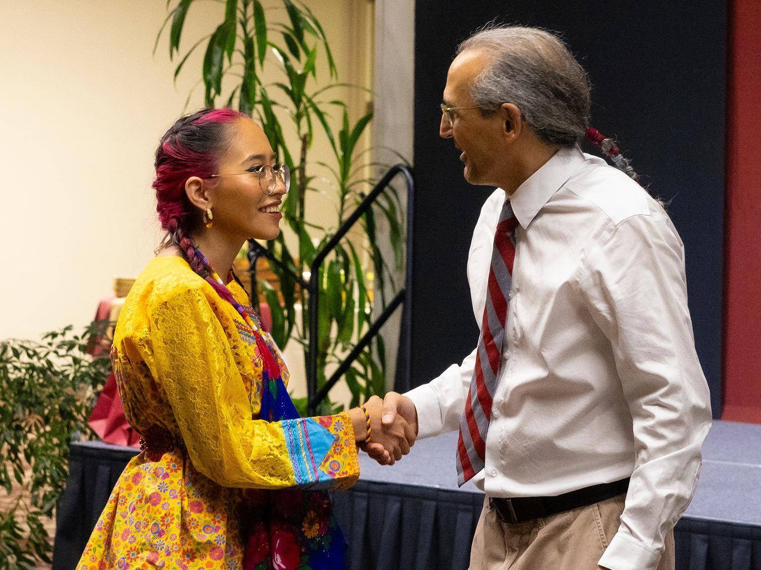 a person and person shaking hands