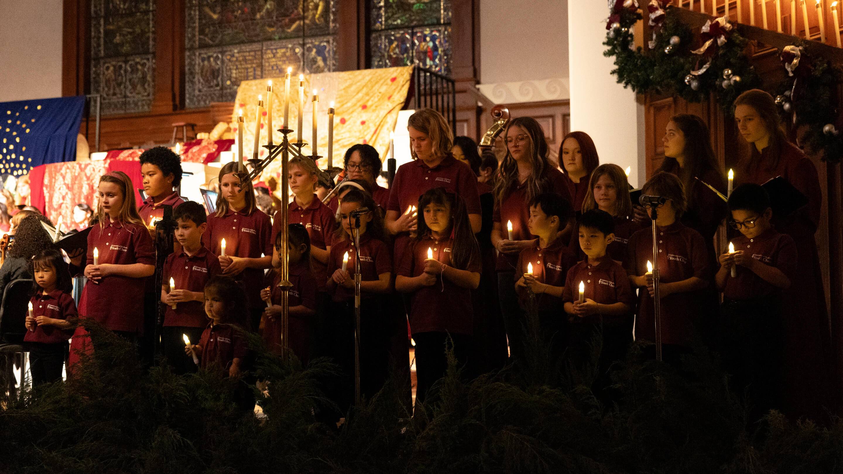 a group of people holding candles