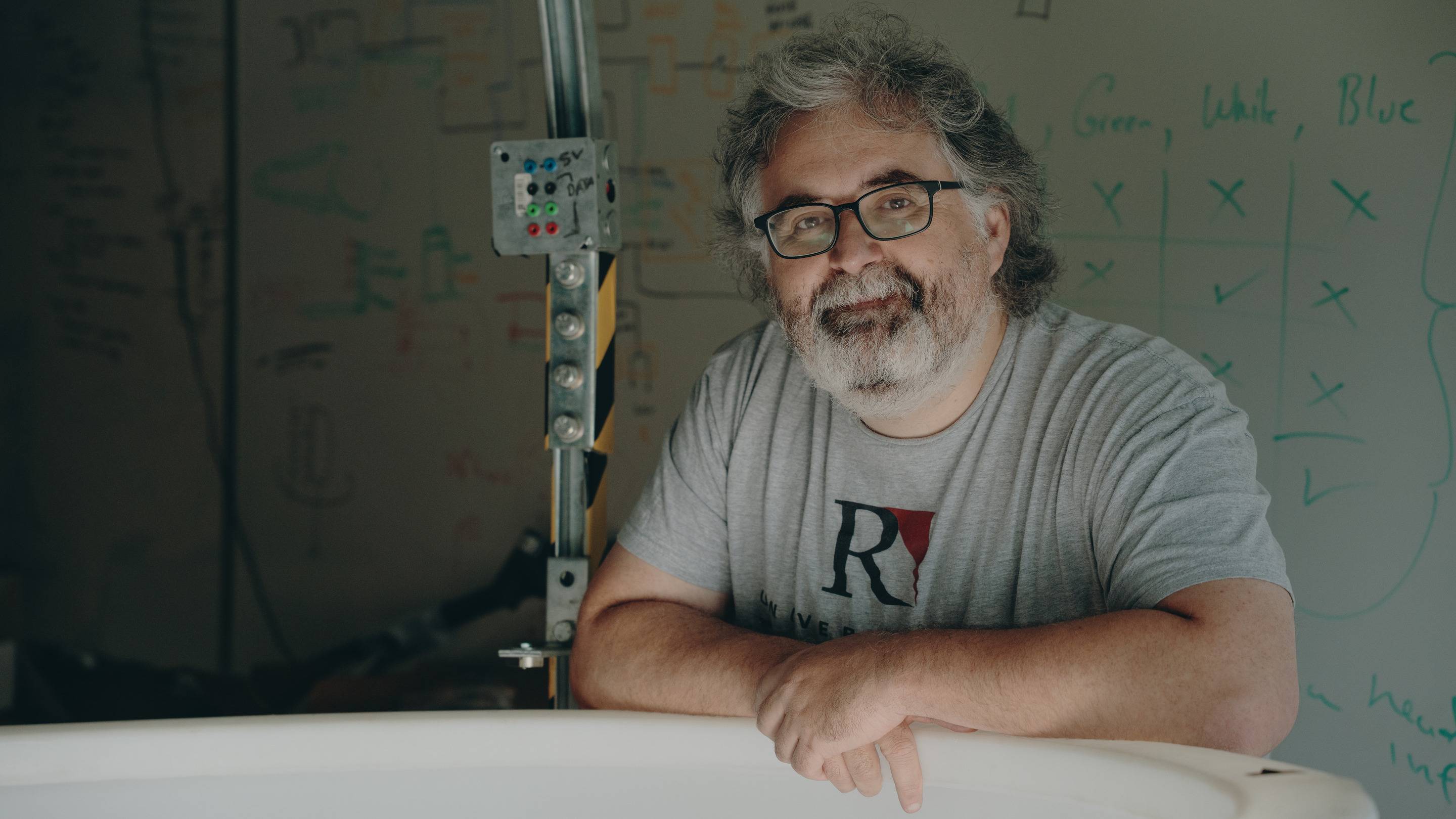 a person leaning on a white bathtub