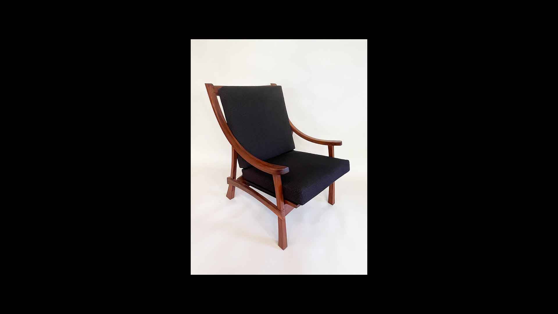 a black chair with wooden armrests