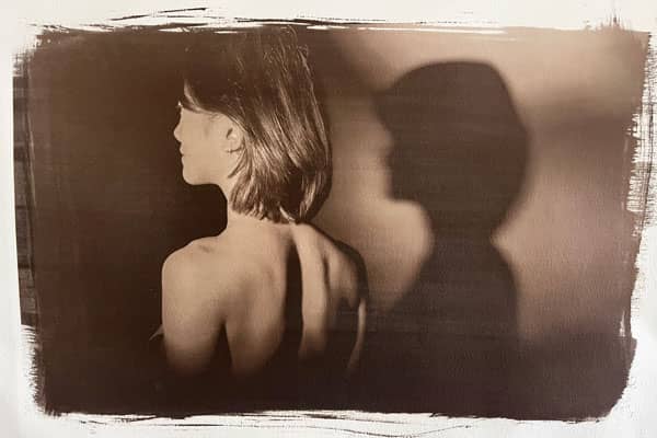 a person with her back turned to the side