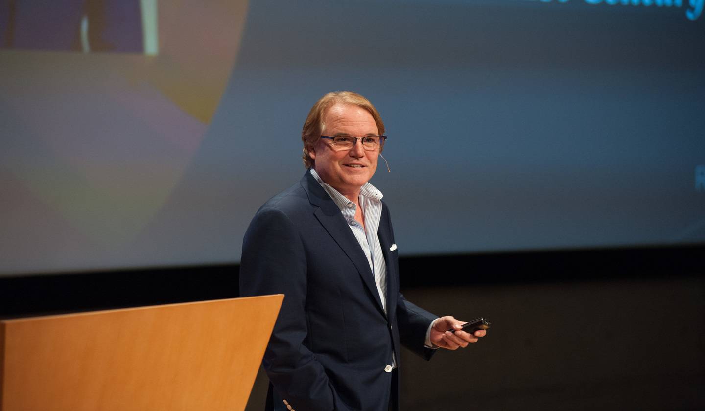 a person standing at a podium