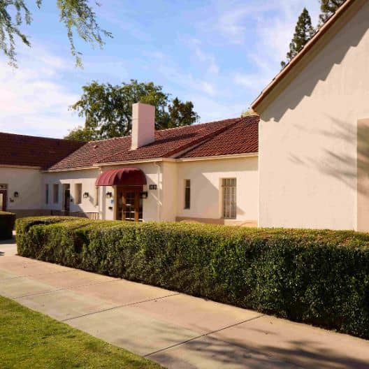 a white building with a red roof
