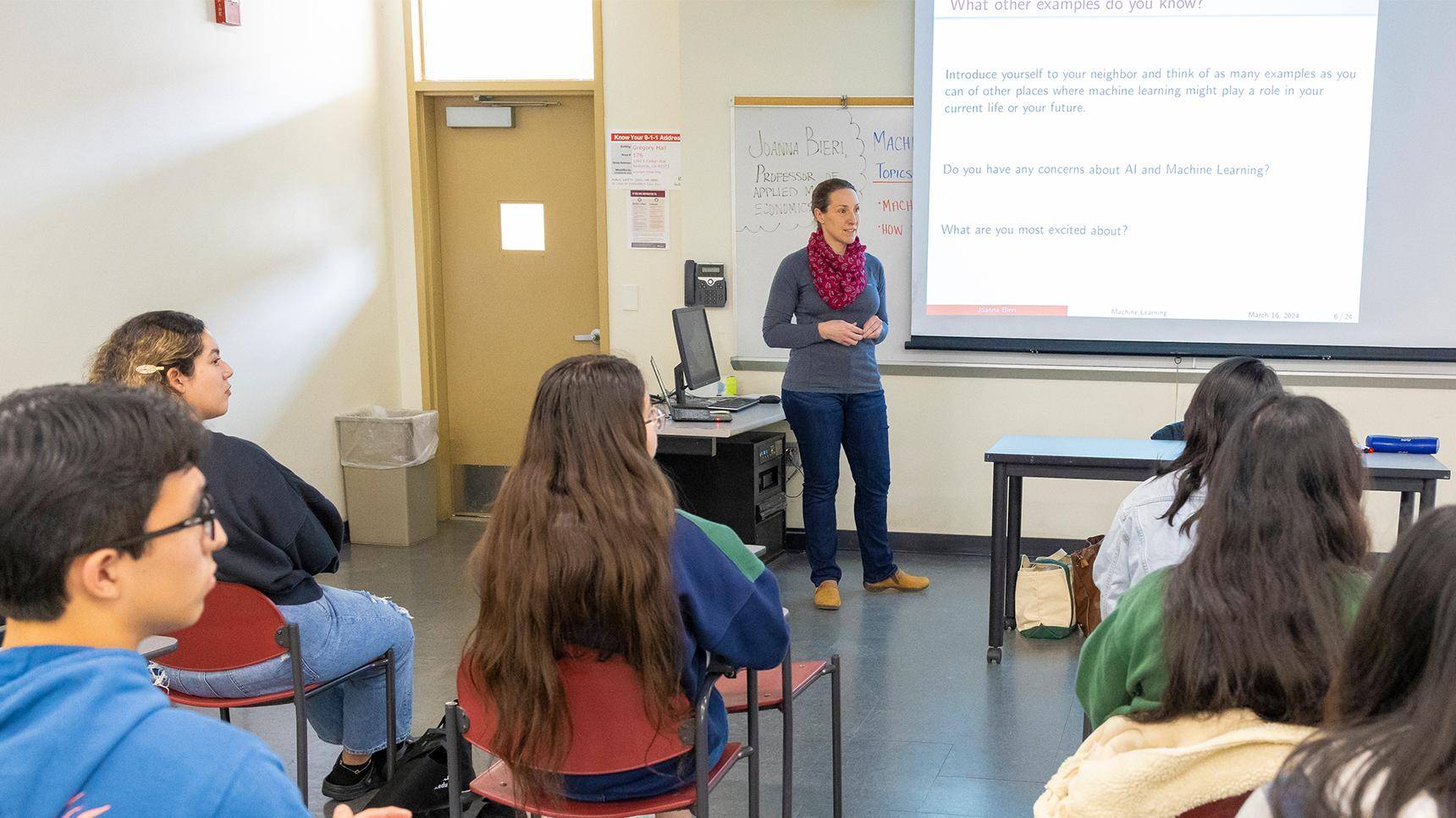 a person standing in front of a whiteboard