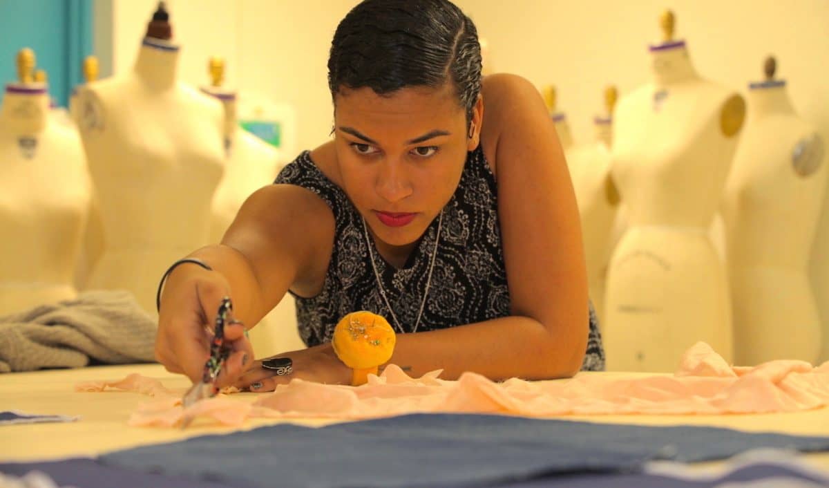 a person working on a fabric