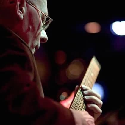 a person playing a guitar