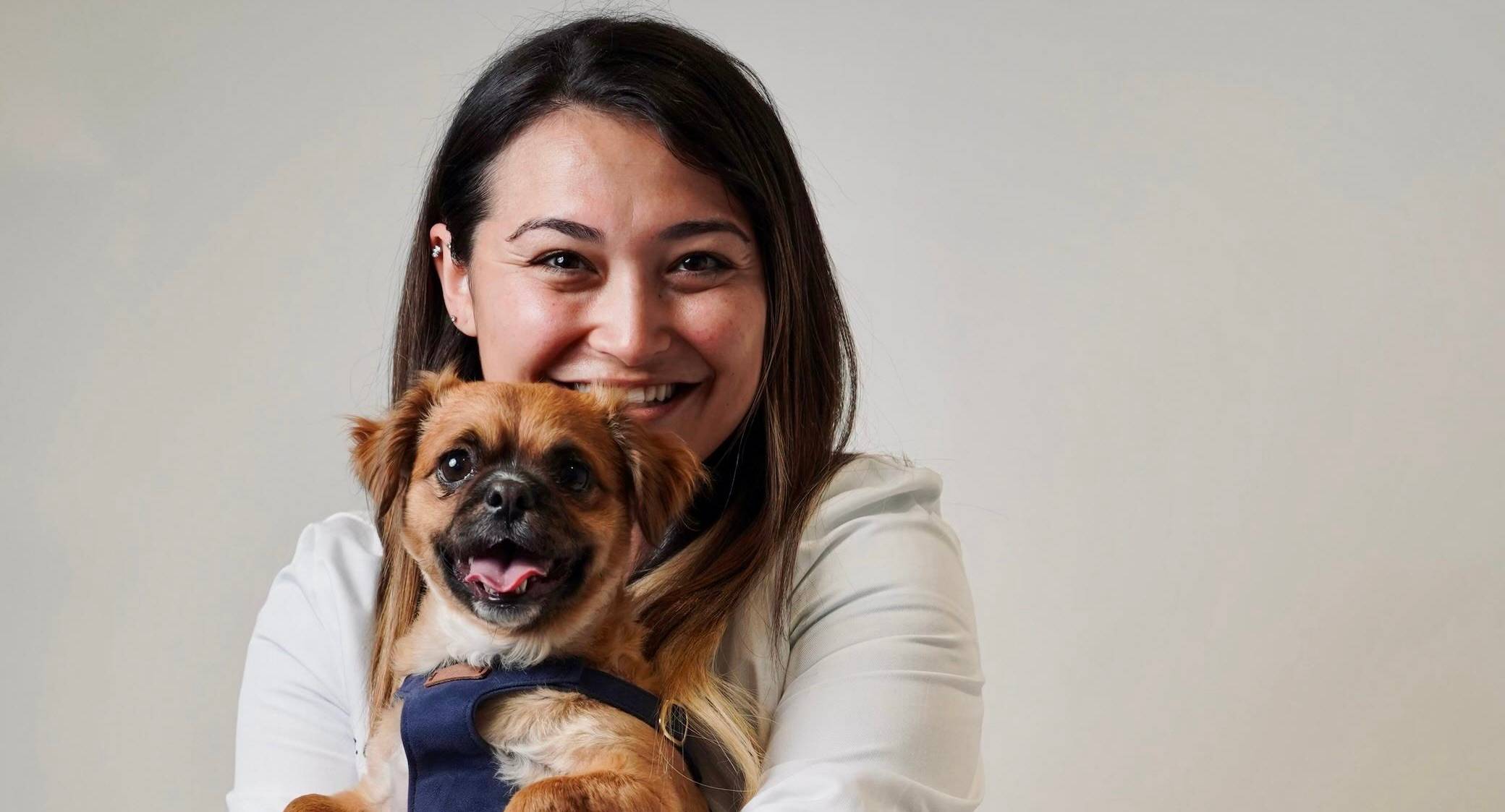 a person holding a dog