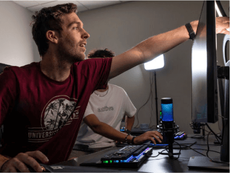 a person pointing at a computer screen