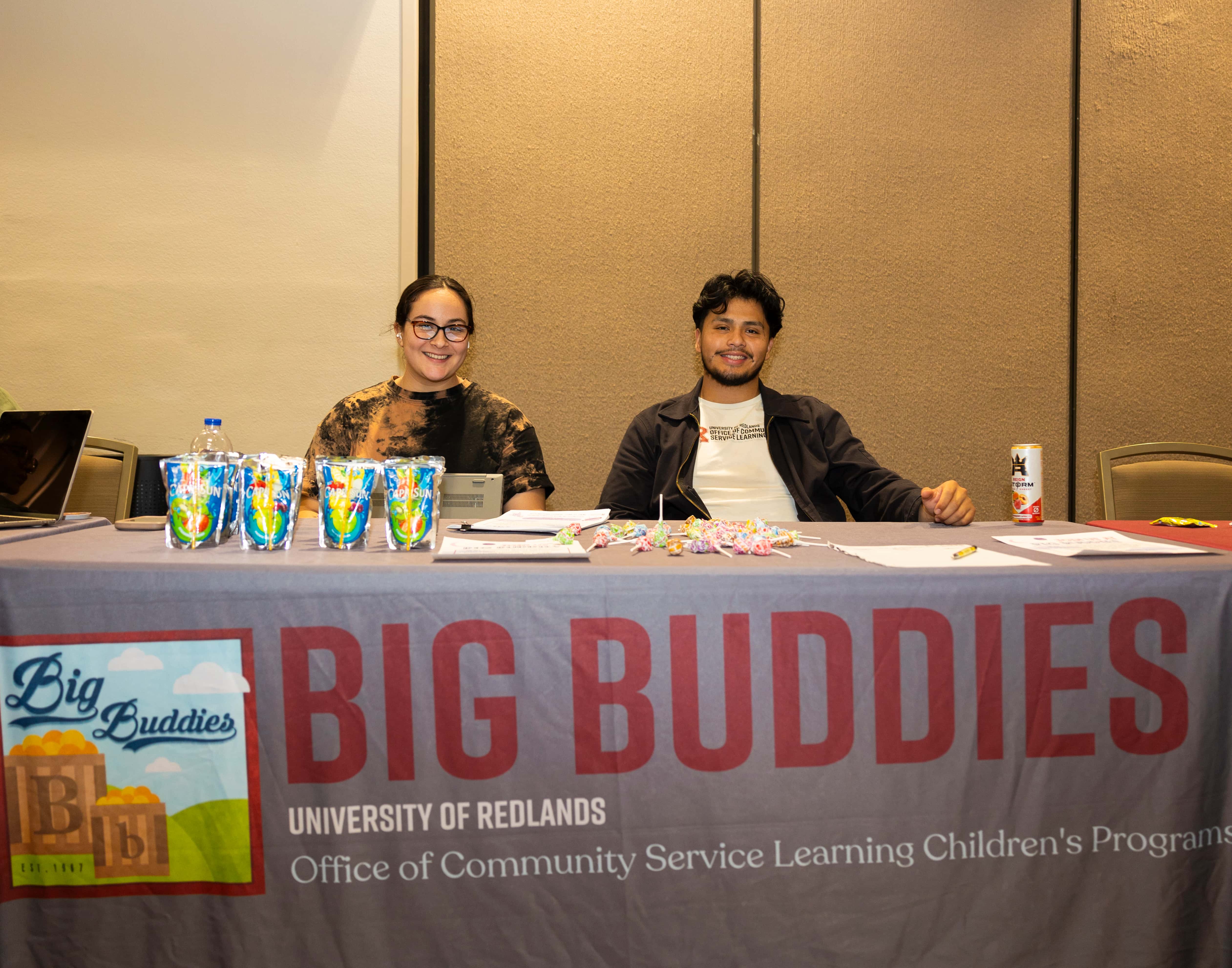 a person and person sitting at a table