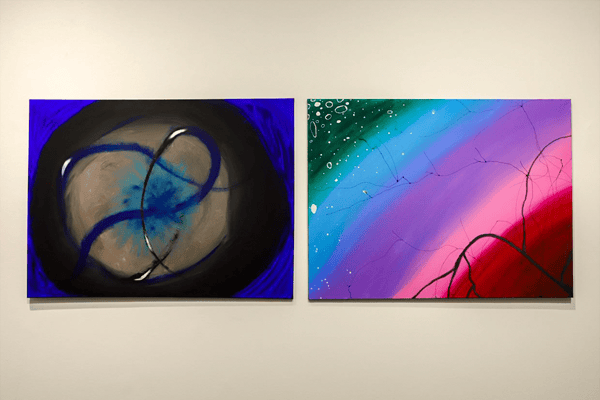 two paintings on a wall