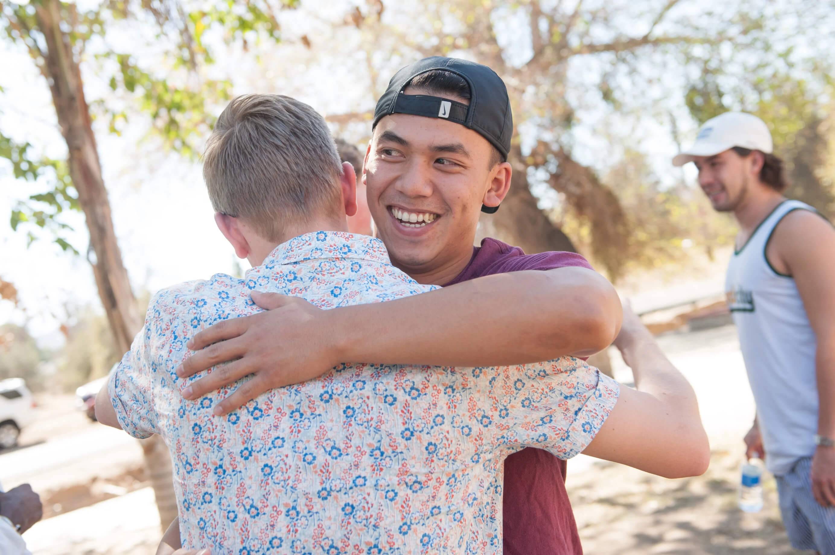 a person hugging another person