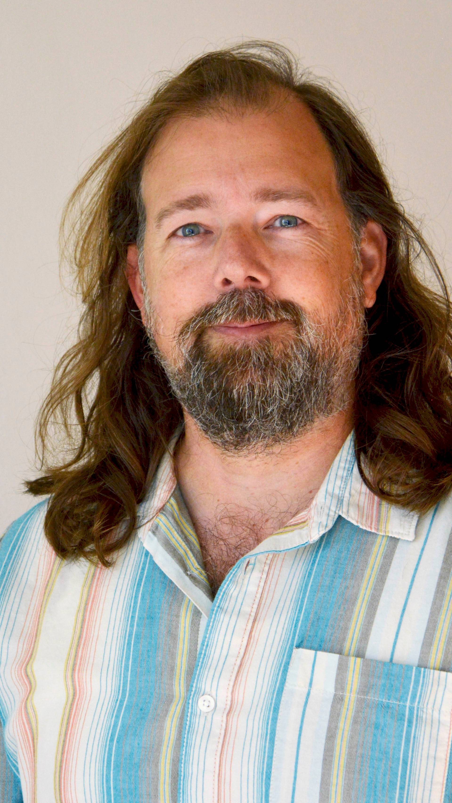 a person with long hair and beard
