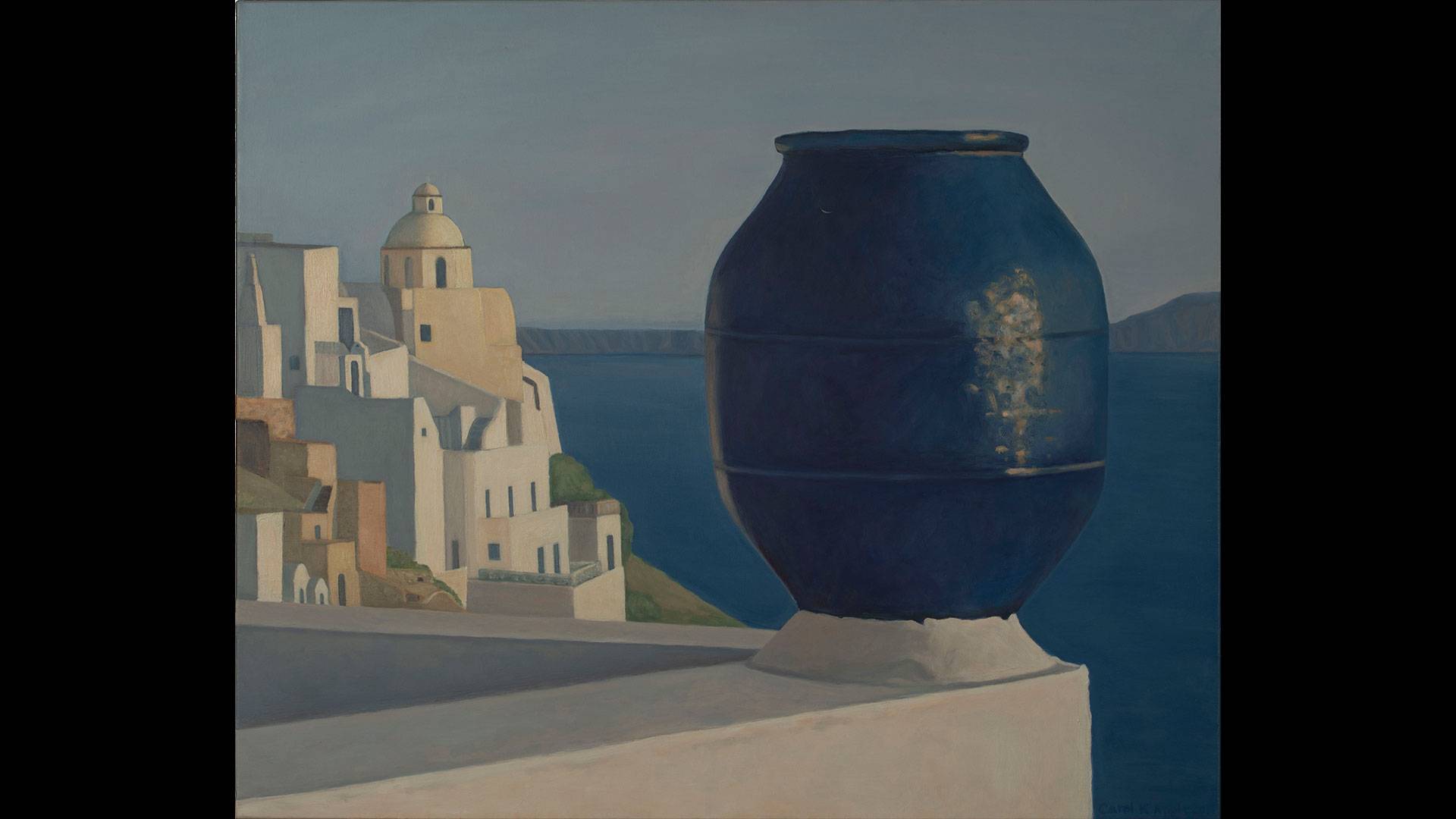 a large blue pot on a ledge overlooking a white city