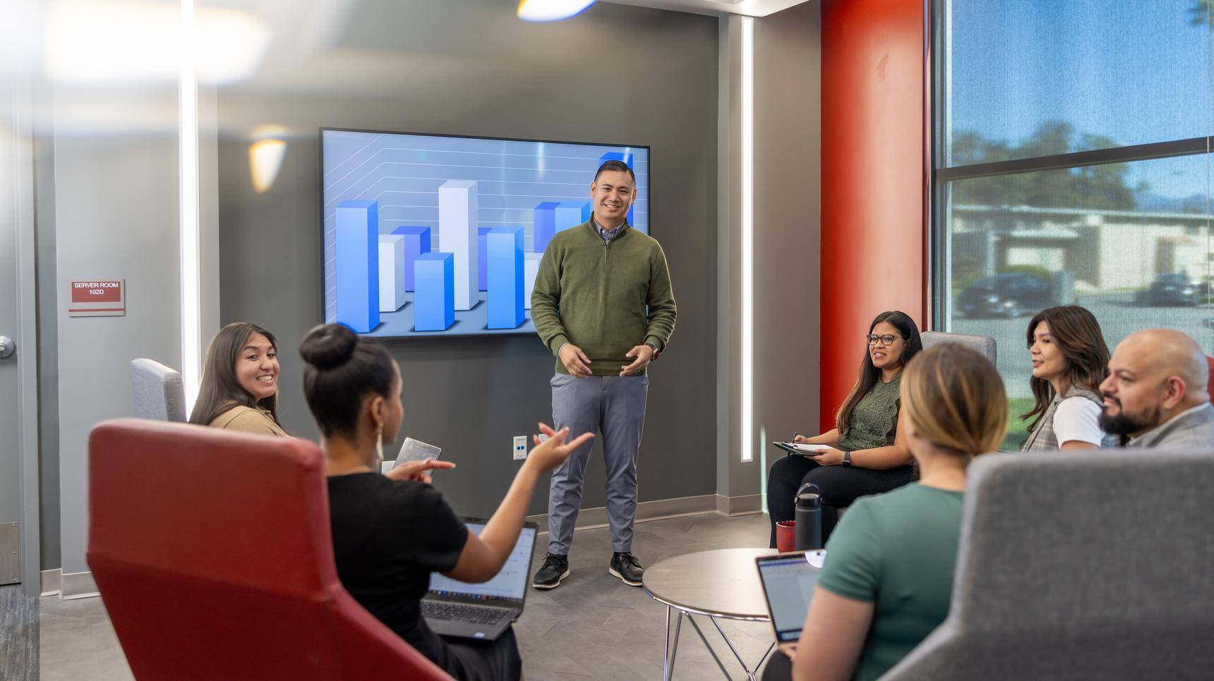 a person standing in front of a group of people