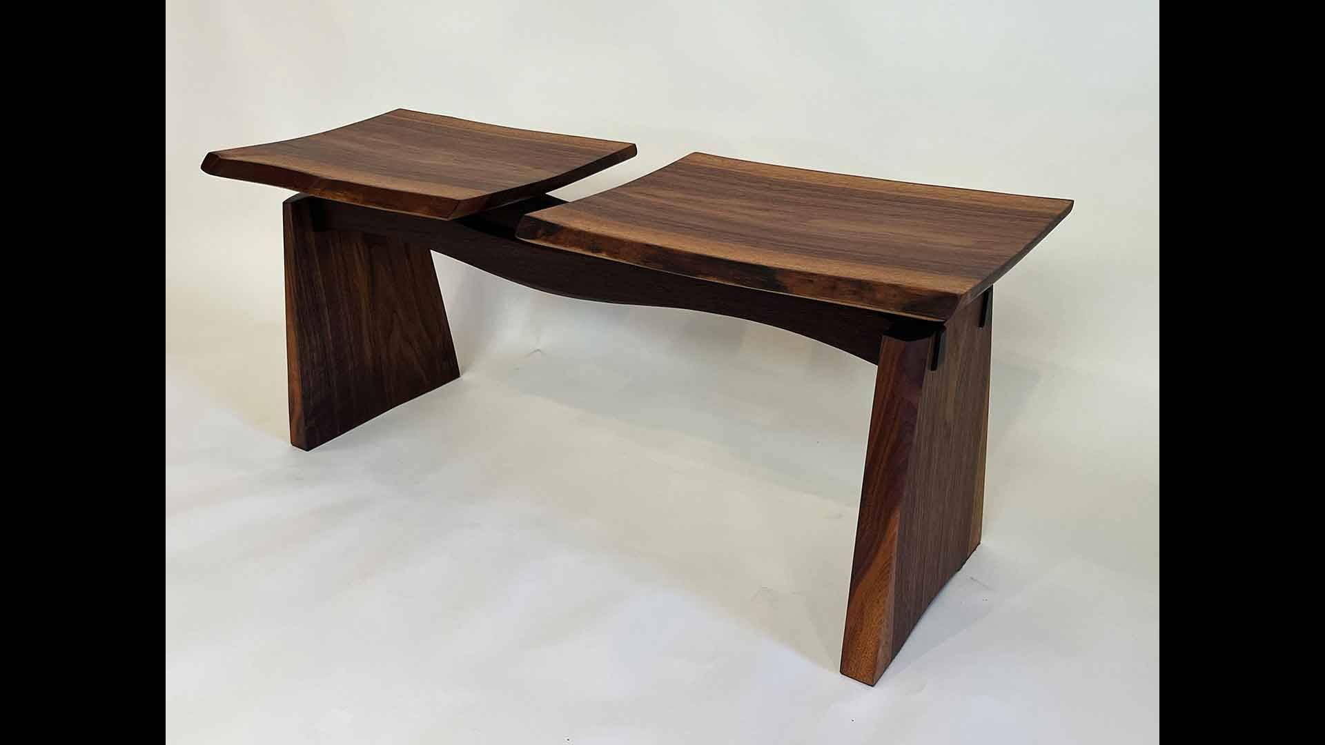 a wooden bench with two sides