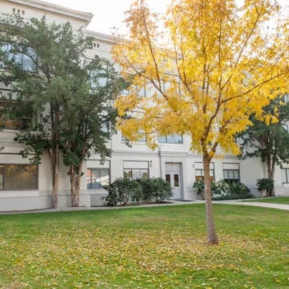 a building with trees in front of it
