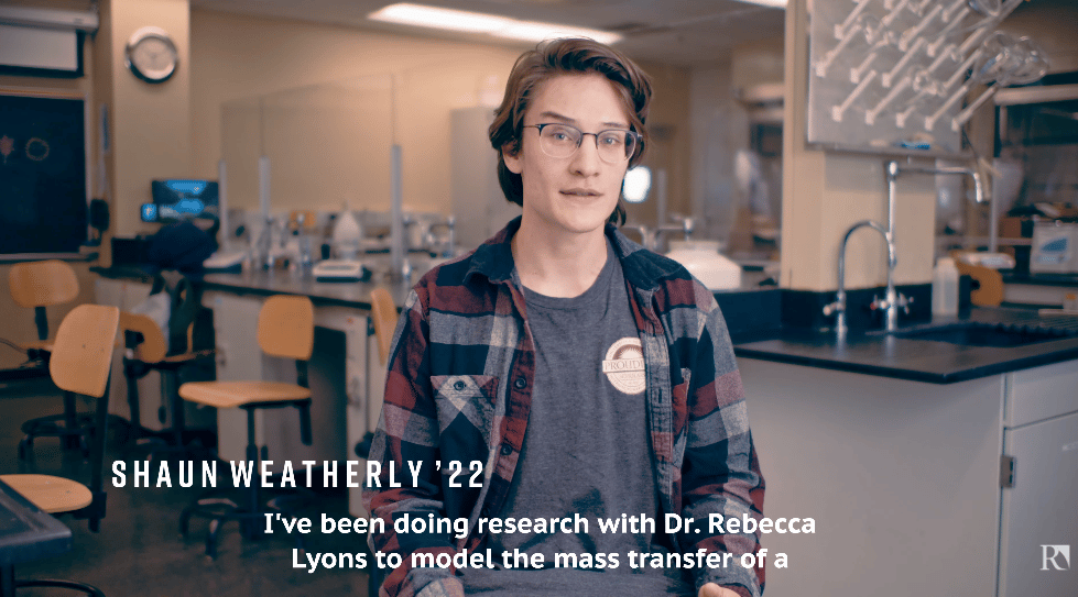 a person in a room with a science lab