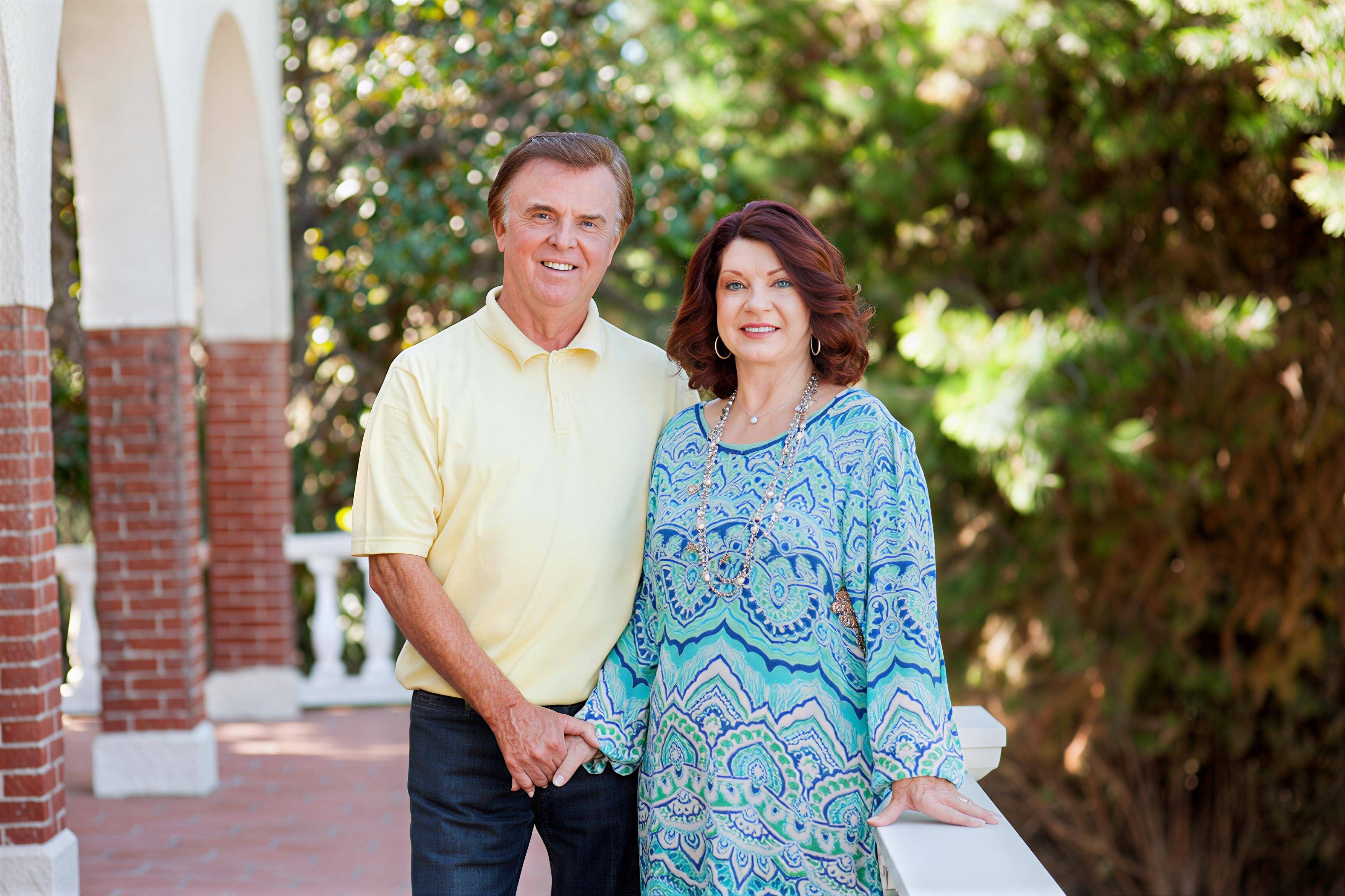 a person and person standing together