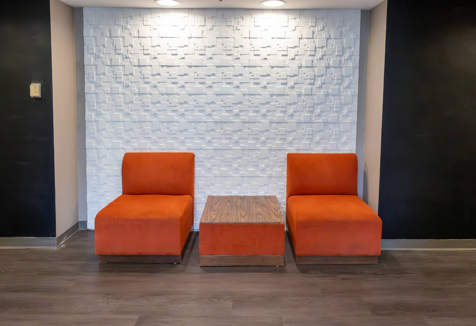 two chairs and a table in a room
