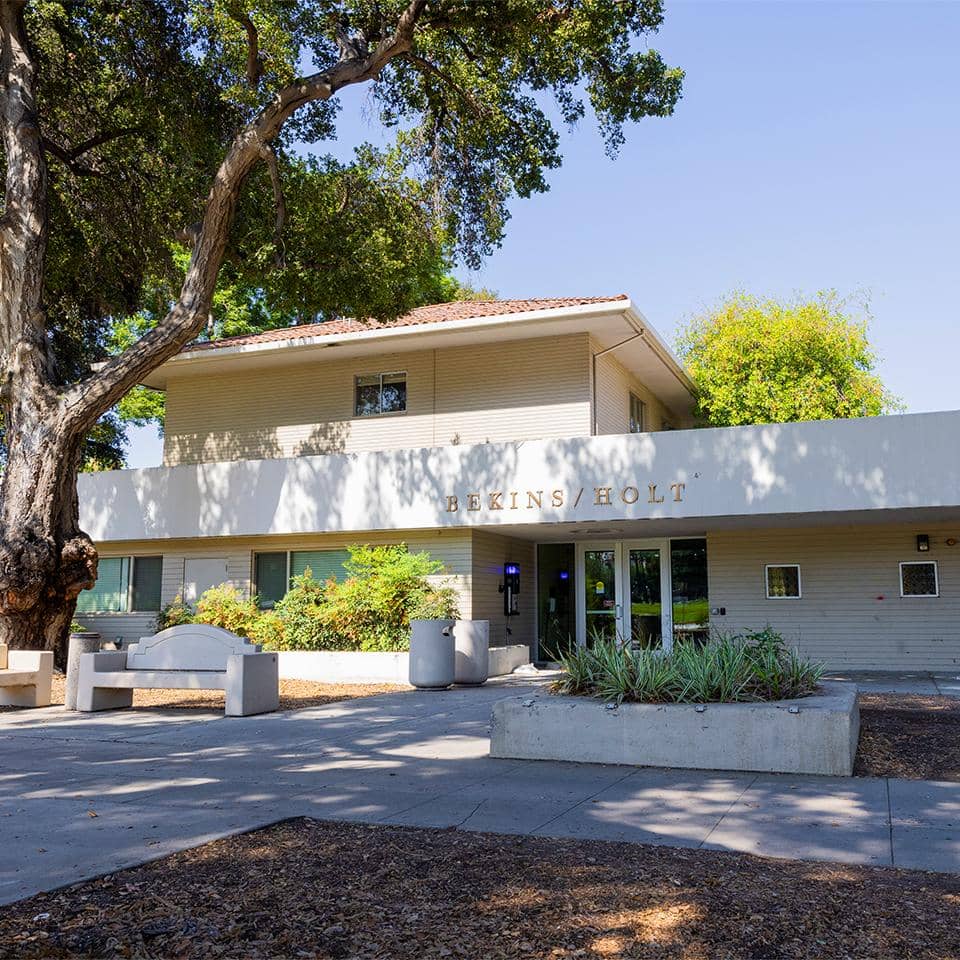 a building with a tree in front