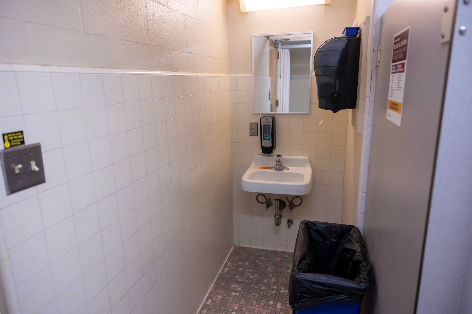 a bathroom with a mirror and a sink