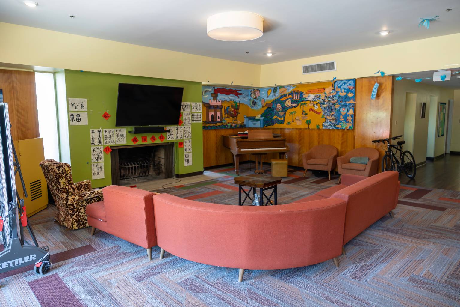a room with couches and a piano