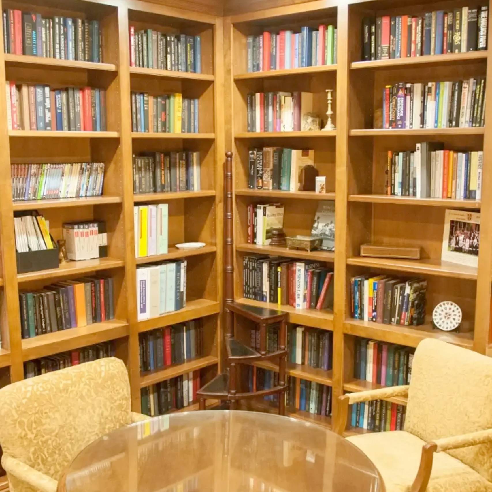 a room with bookshelves and a table