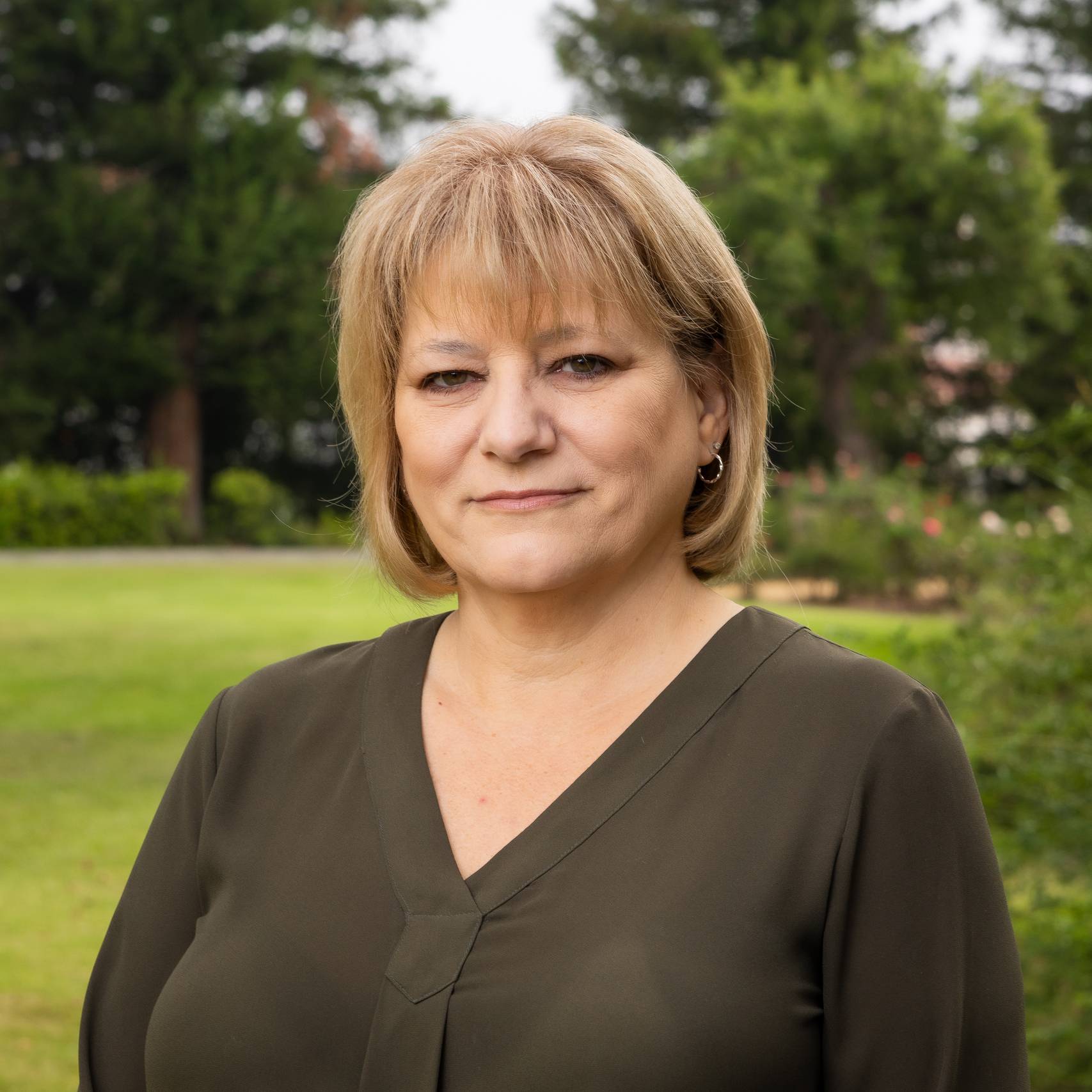 a person standing in a grass field