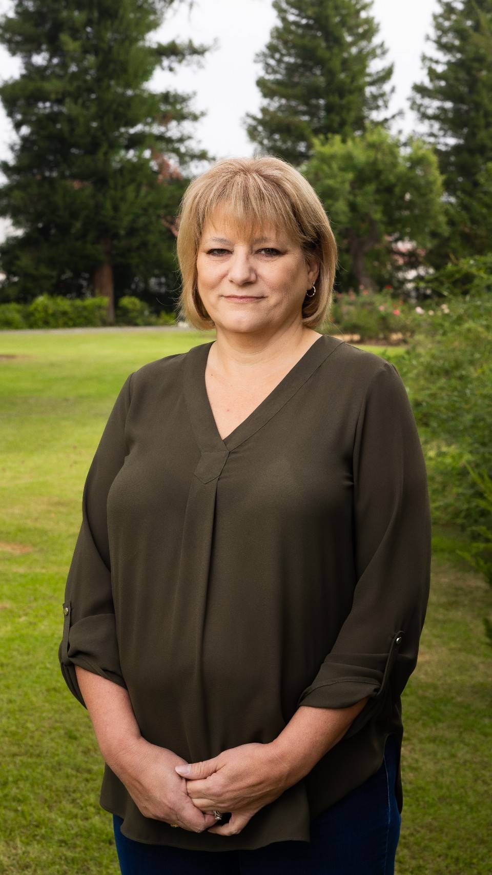 a person standing in a grass field