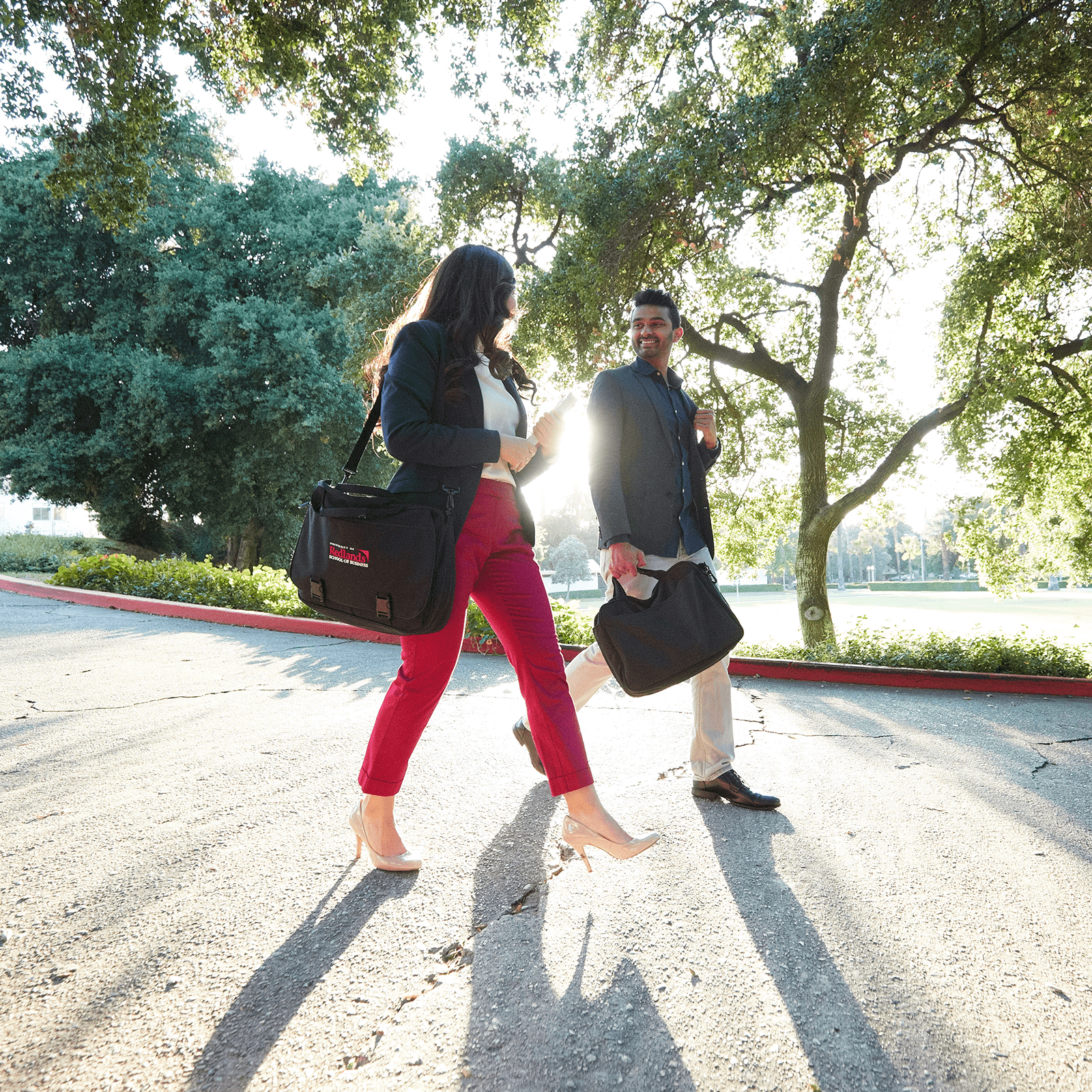 a person and person walking on a road