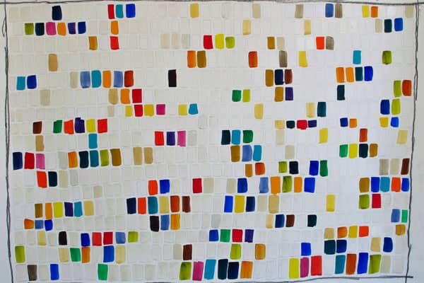 a white wall with persony squares of different colors