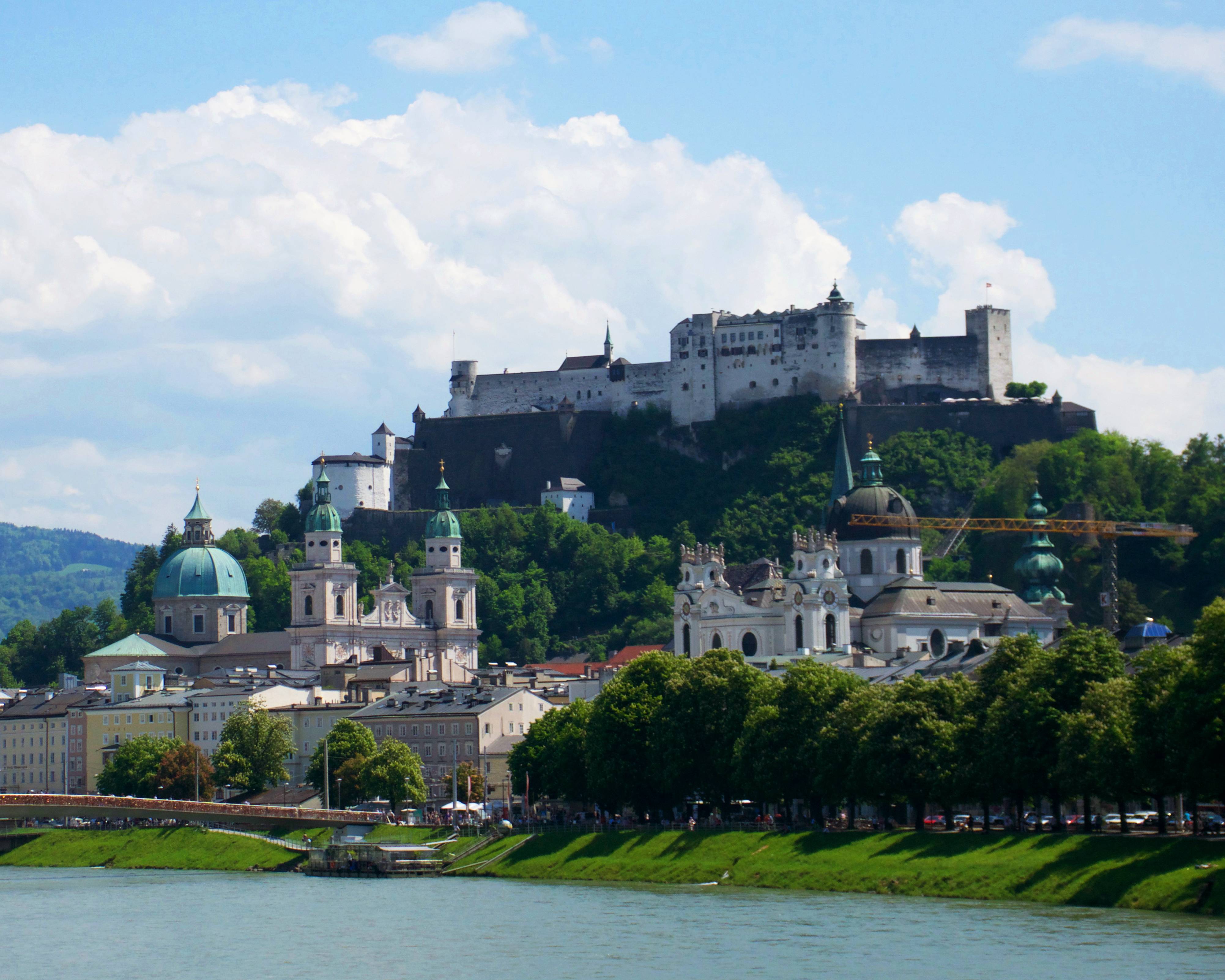 a city with a castle on top of it