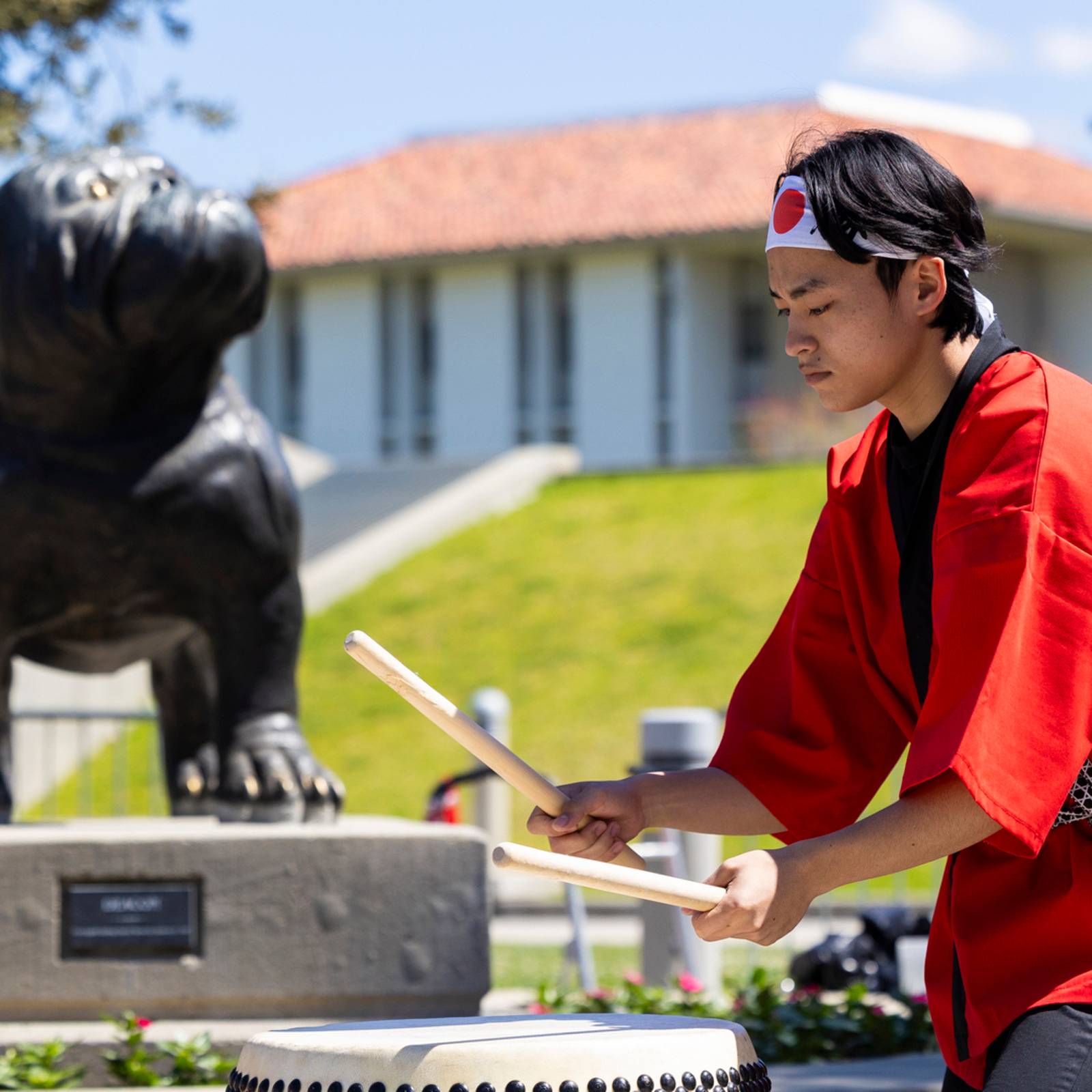 a person playing drums outside