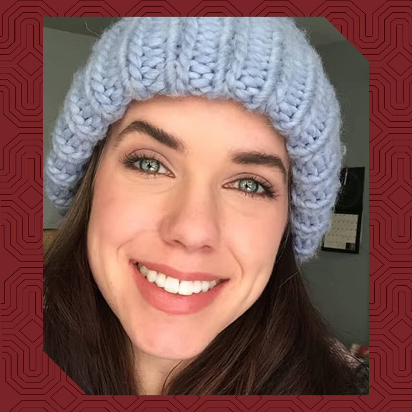 Heather Openshaw smiles while wearing a light blue knit hat.