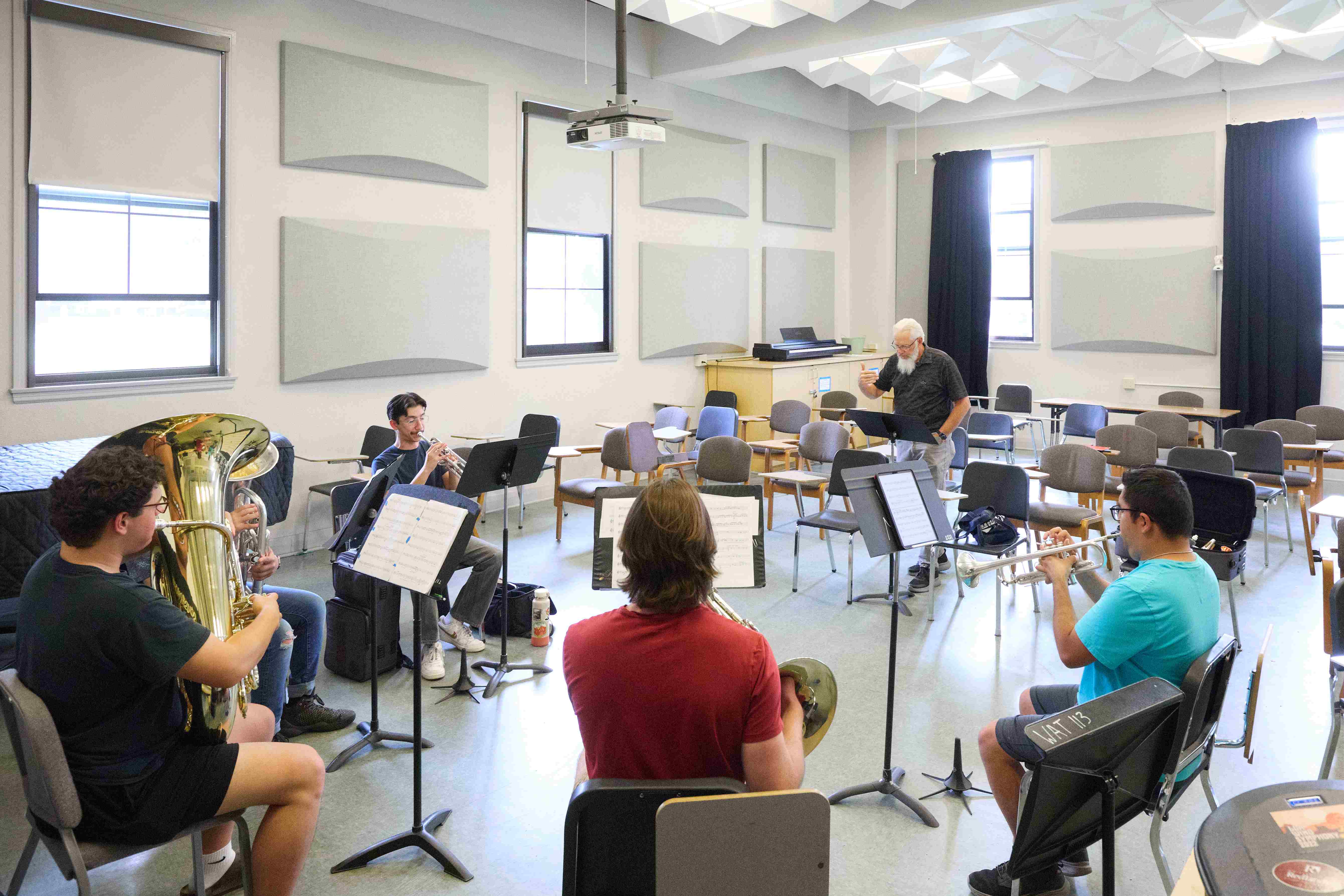 a group of students in a room with musical instruments