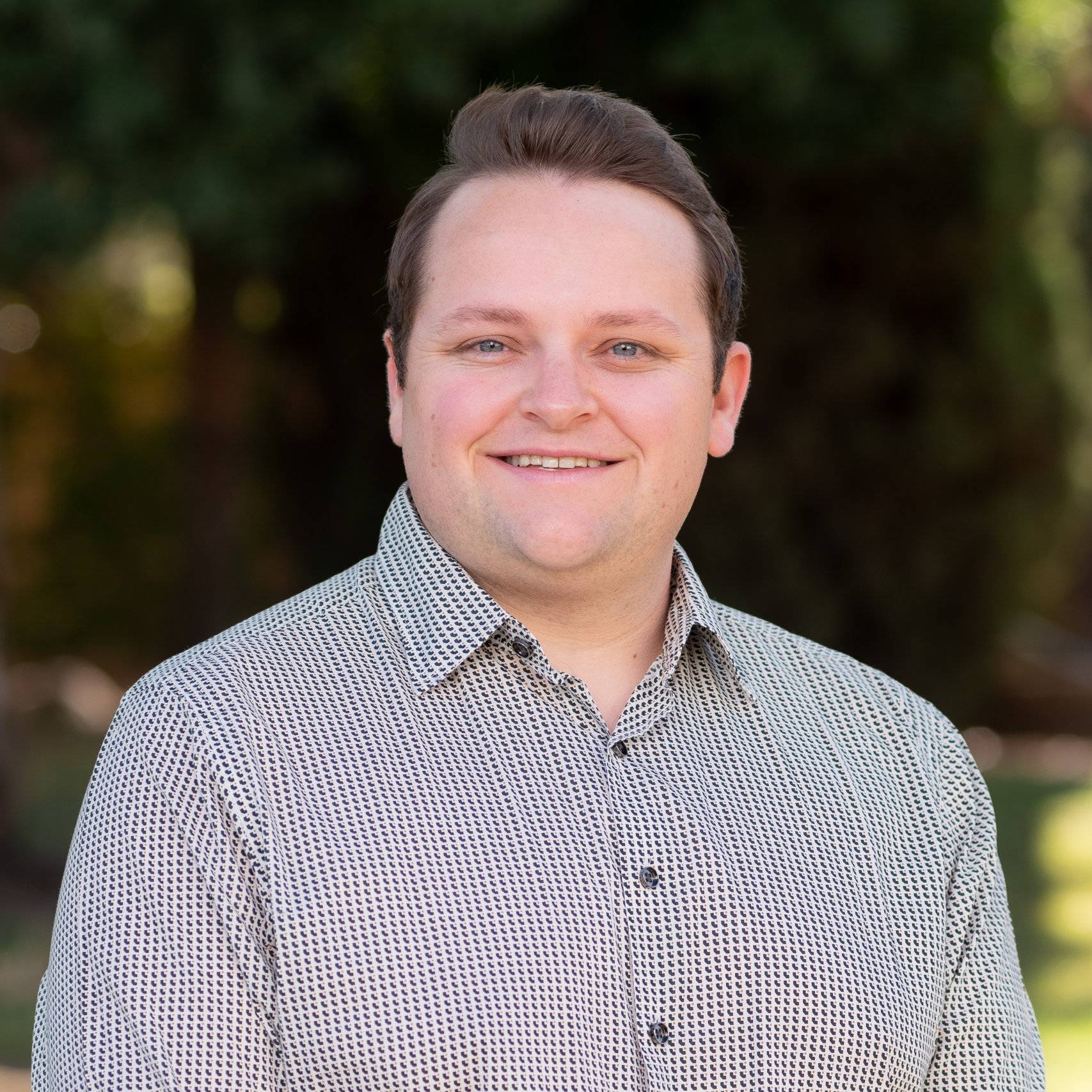 a person smiling for a picture