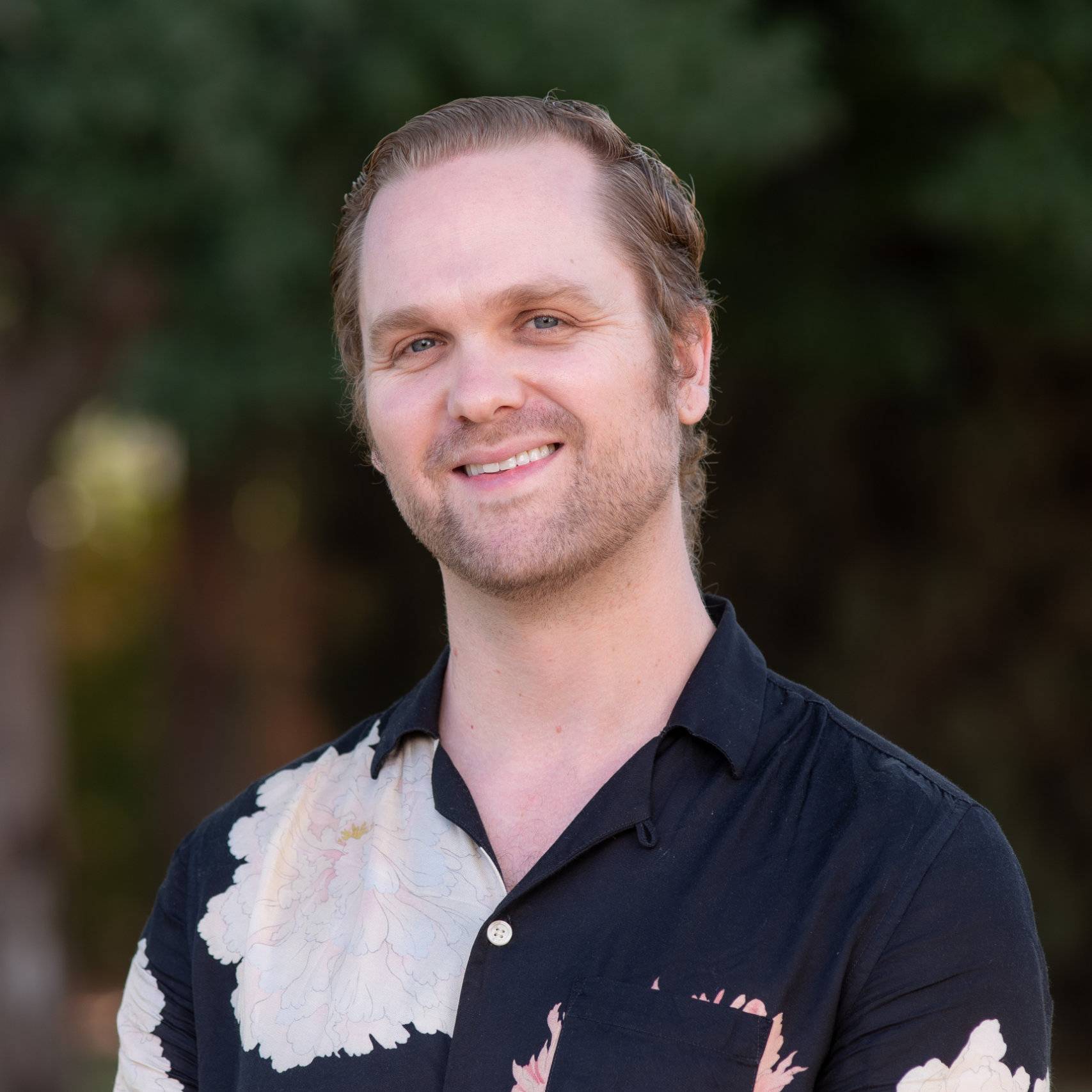 a person smiling for a picture