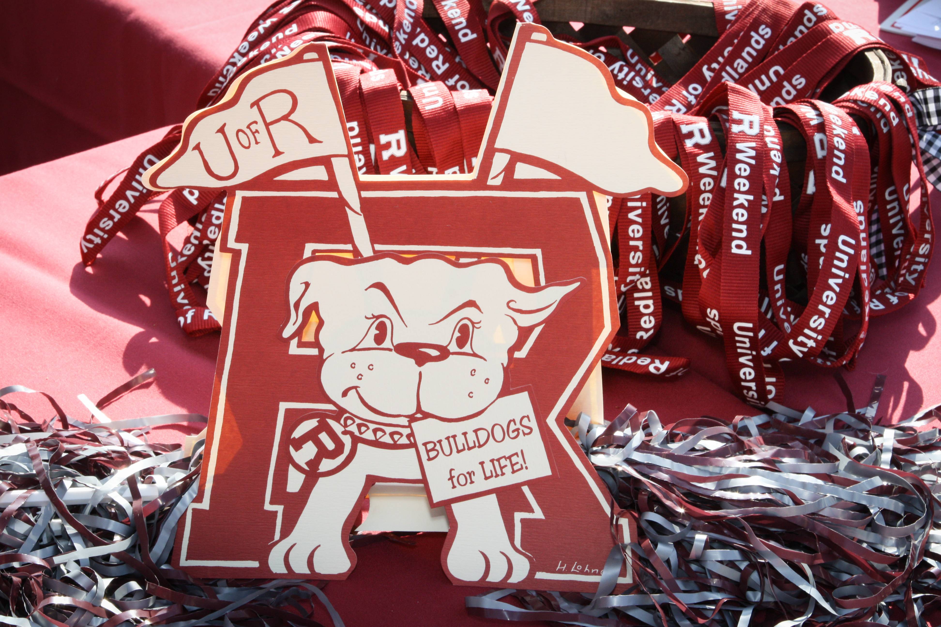 a red and white sign with a dog and a flag on it