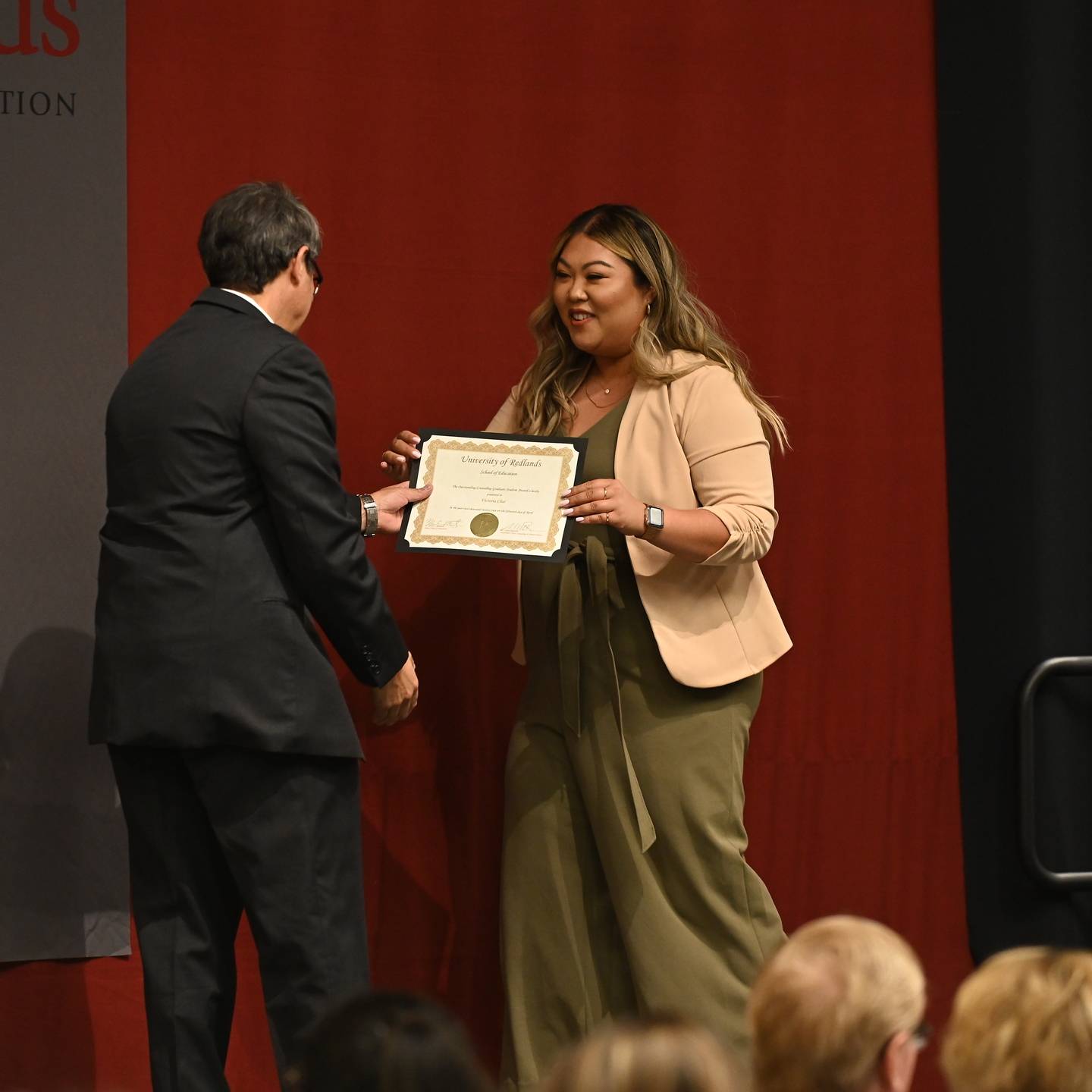 a person holding a certificate