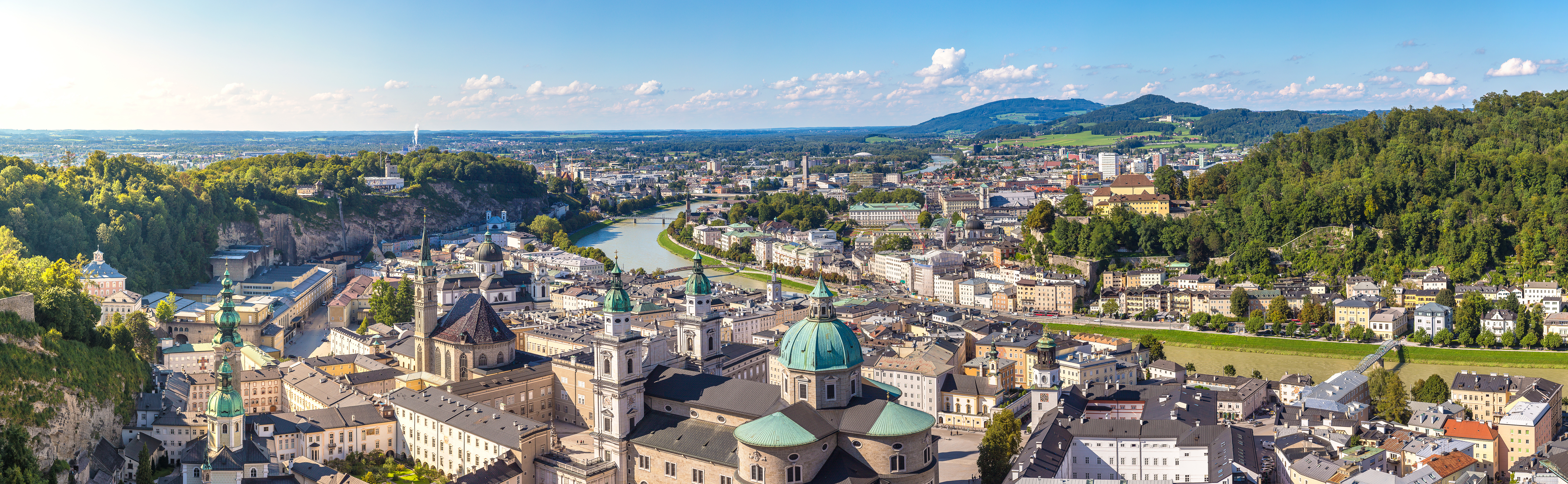a city with a river and a large building
