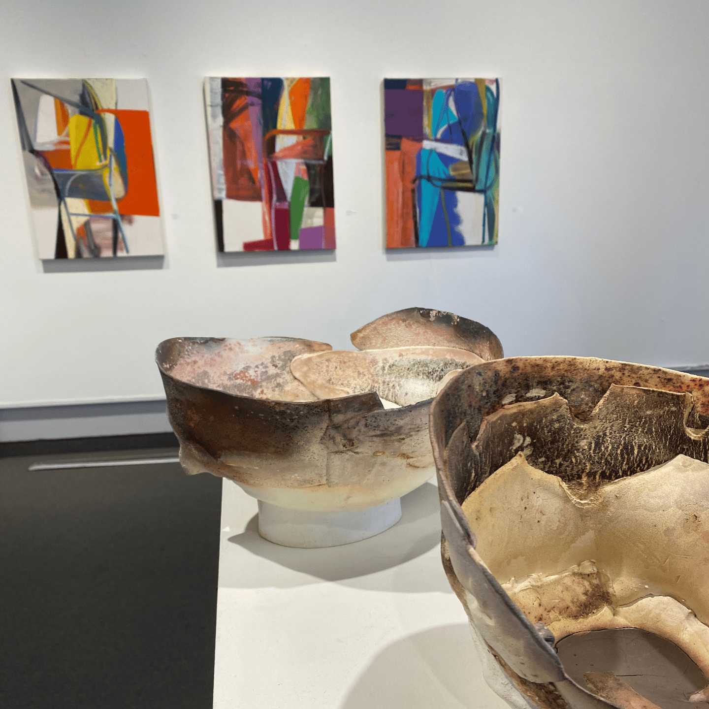 a group of art pieces on a table