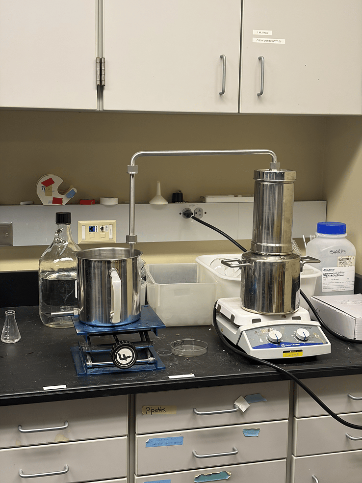 a laboratory with a machine and a container
