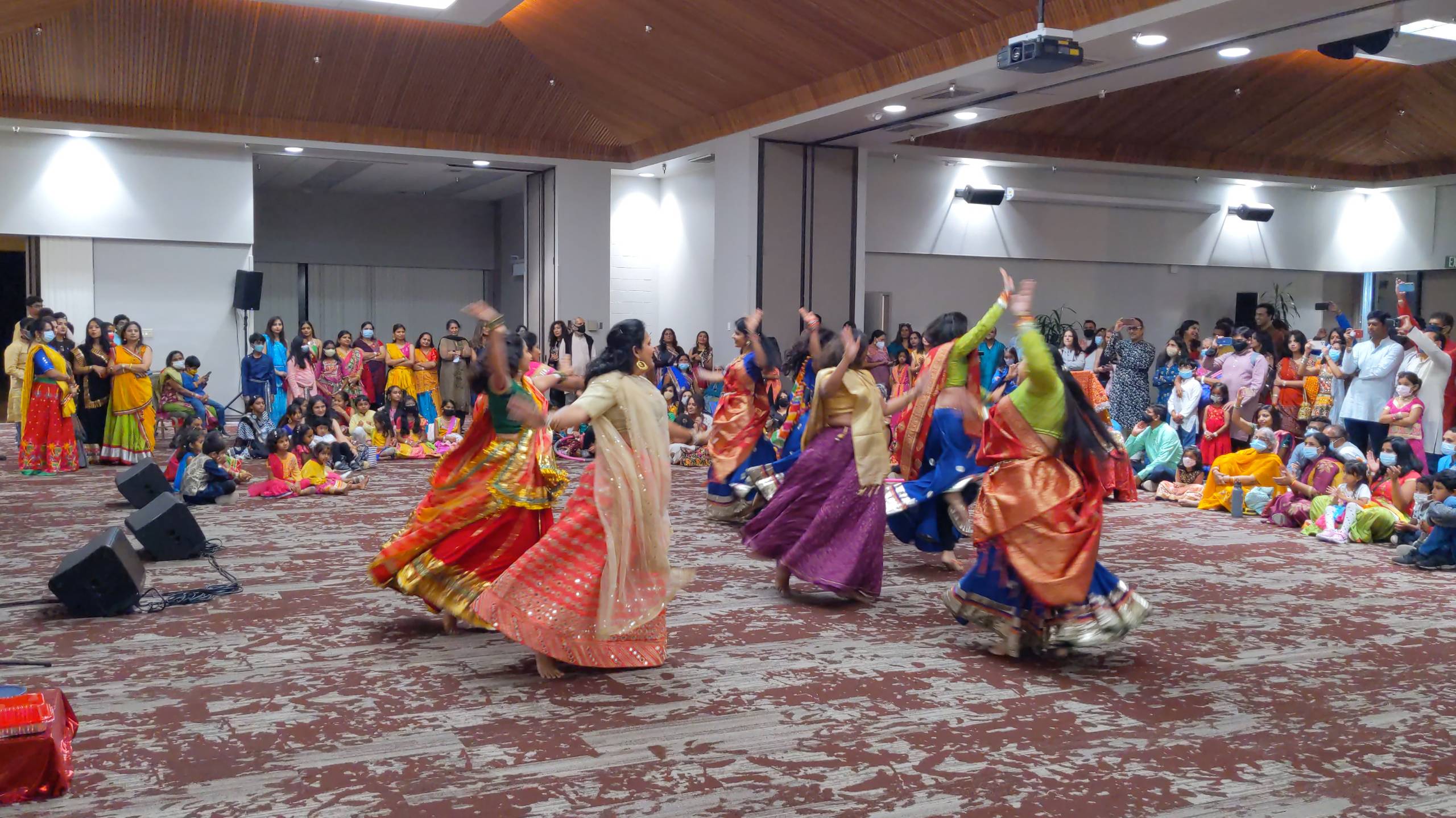 a group of women dancing in a room