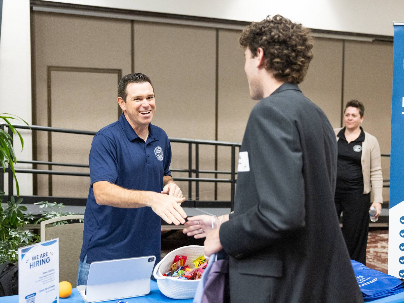 a person handing a hand to another person