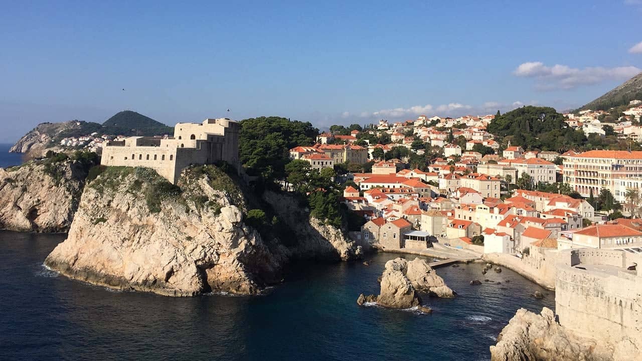 a city on a cliff by water