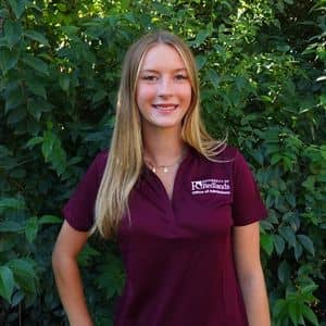 a person in a maroon shirt