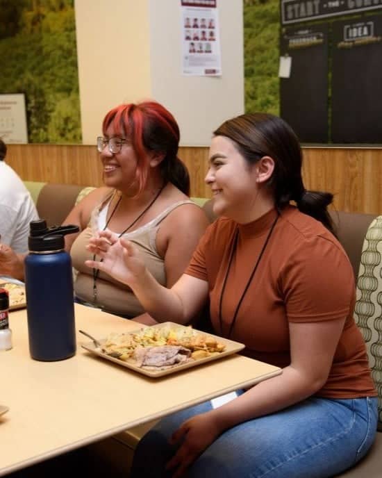 a group of women sitting at a table