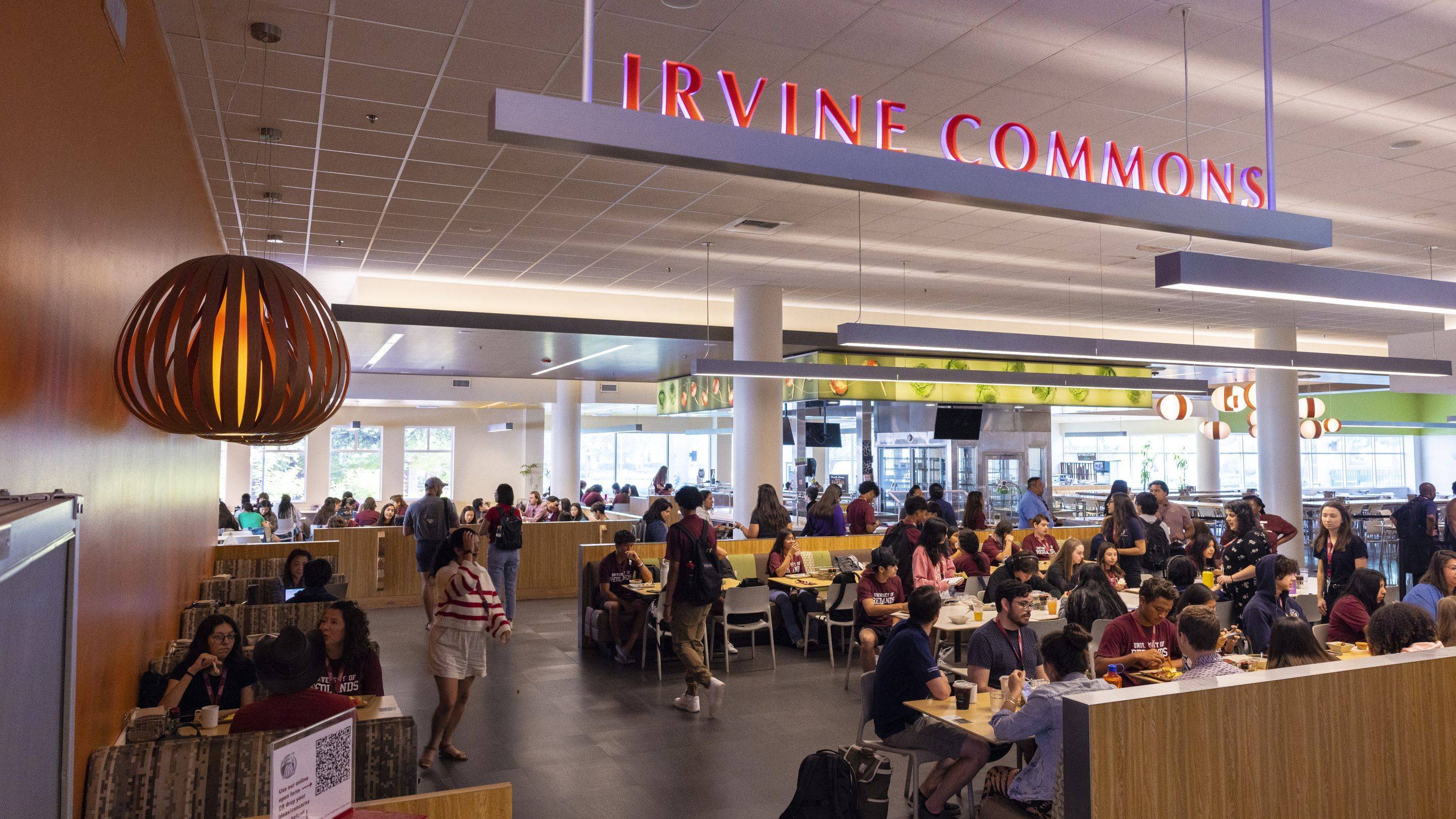 Students sit and gather throughout Irvine Commons dining hall at University of Redlands.